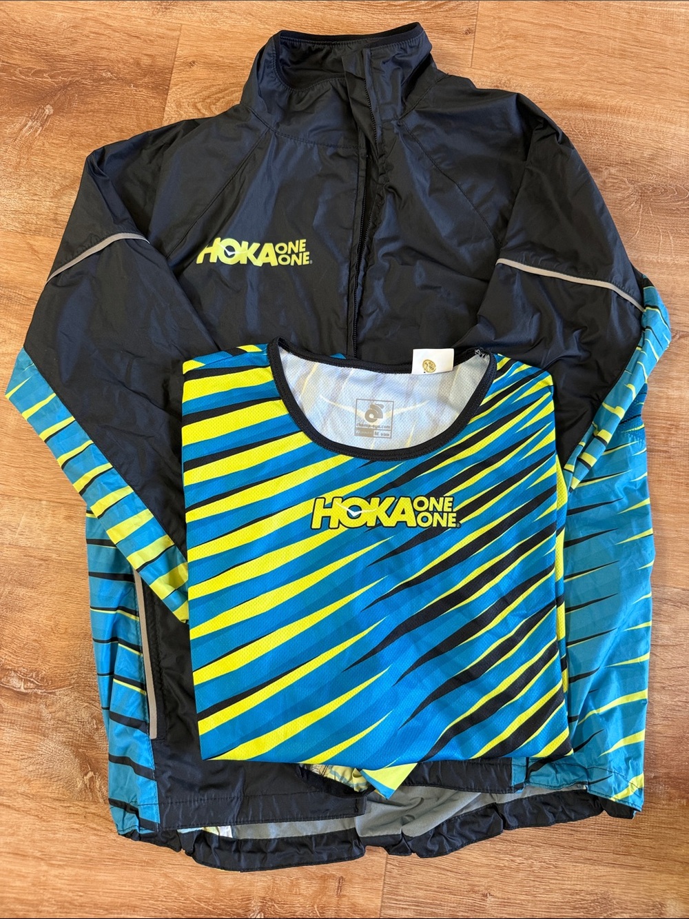 Hoka One One Women’s Black Jacket with Blue & Yellow Striped Top - Picture 5 of 5